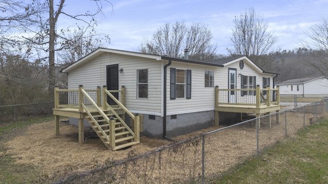 view of front of home with a wooden deck