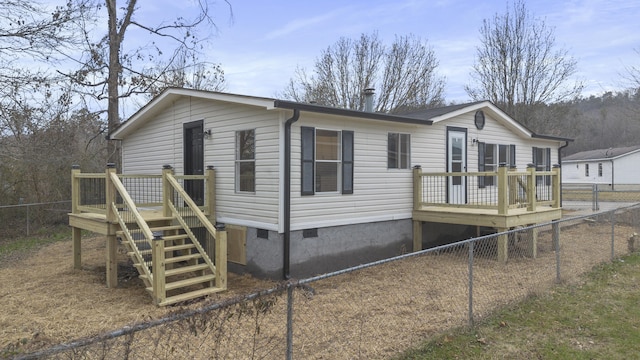 view of home's exterior featuring a wooden deck