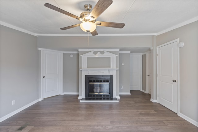 unfurnished living room with hardwood / wood-style flooring, ceiling fan, and ornamental molding