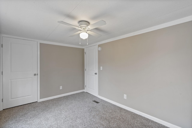 carpeted empty room with ceiling fan