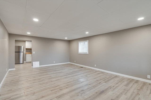 spare room featuring light wood-type flooring