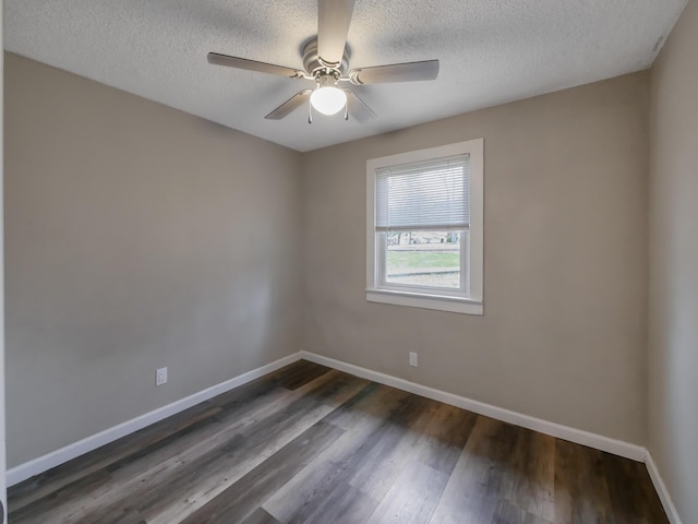 unfurnished room featuring dark wood-type flooring, a textured ceiling, and ceiling fan