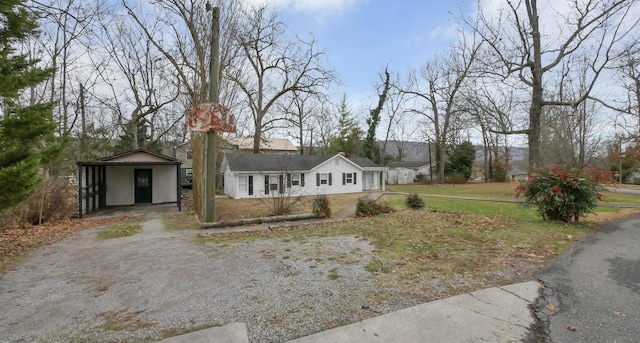 single story home featuring a carport