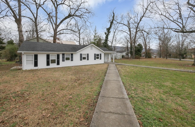 ranch-style house with a front lawn