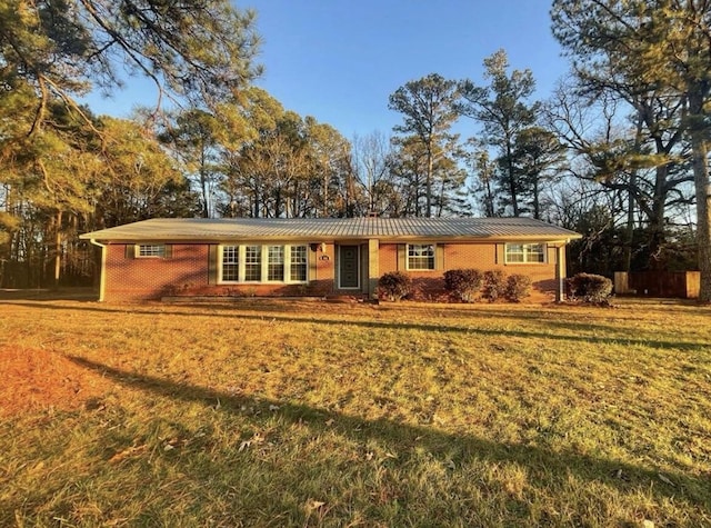 ranch-style house with a front lawn