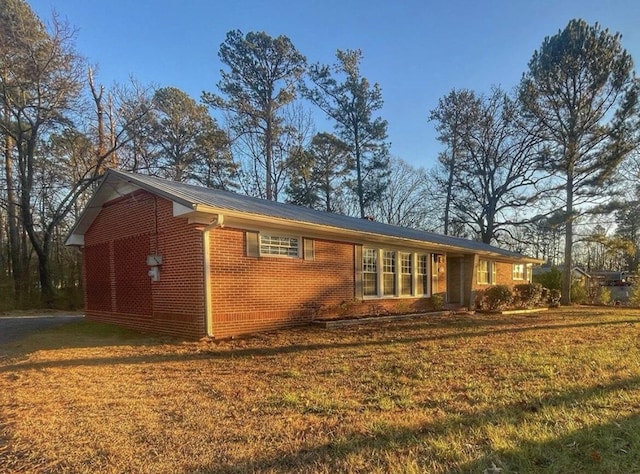 back of house with a yard