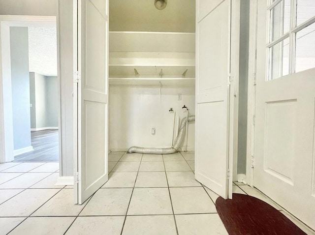 laundry room with light tile patterned flooring