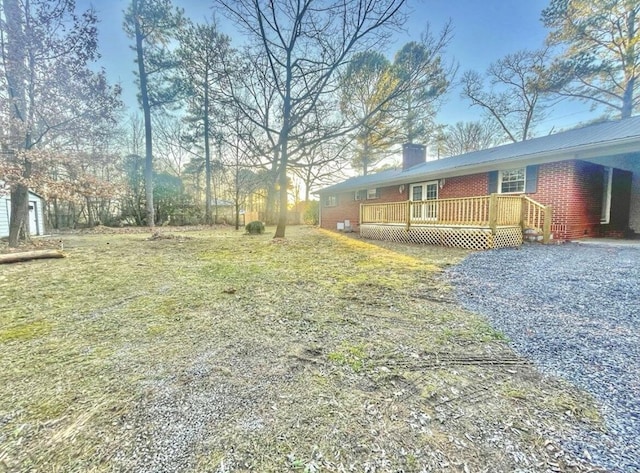 view of yard with a wooden deck