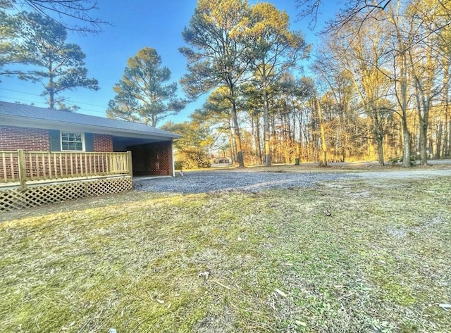 view of yard featuring a wooden deck