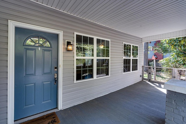 doorway to property featuring a porch