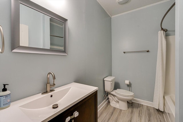 full bathroom featuring hardwood / wood-style flooring, vanity, ornamental molding, shower / bath combination with curtain, and toilet