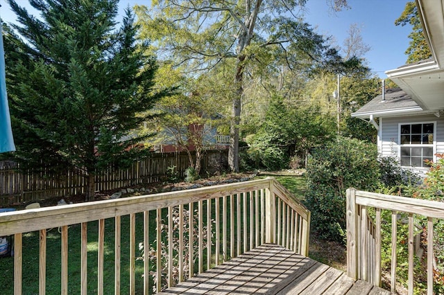 wooden terrace with a yard