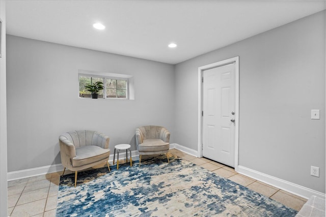 living area featuring light tile patterned floors