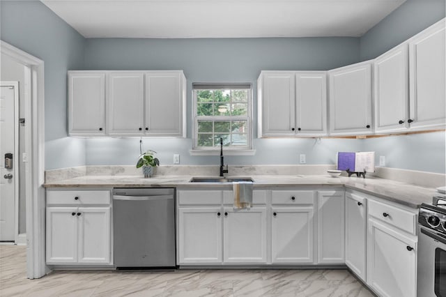 kitchen with white cabinetry, sink, and stainless steel appliances