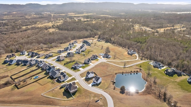 bird's eye view featuring a water and mountain view