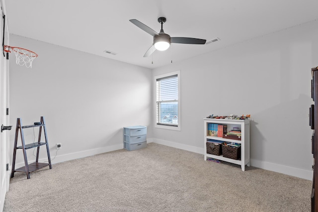 playroom with light carpet and ceiling fan