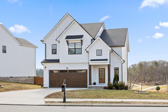 modern farmhouse featuring a garage and a front yard