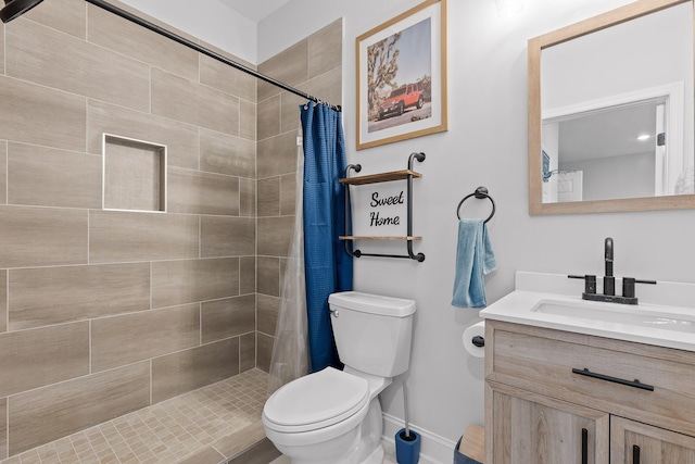 bathroom featuring vanity, toilet, and walk in shower