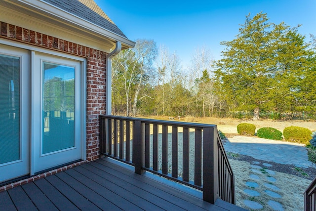 wooden terrace featuring a patio