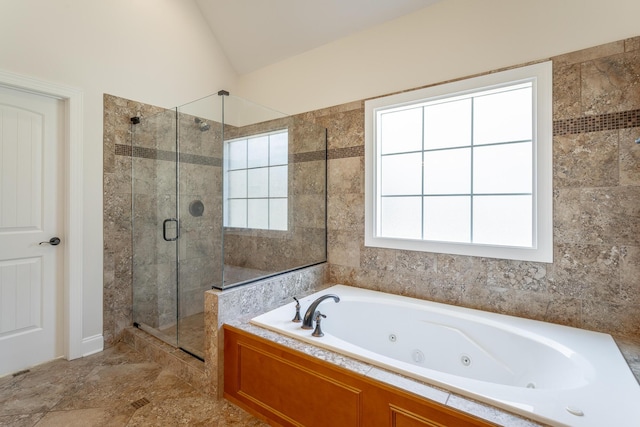 bathroom featuring vaulted ceiling and plus walk in shower