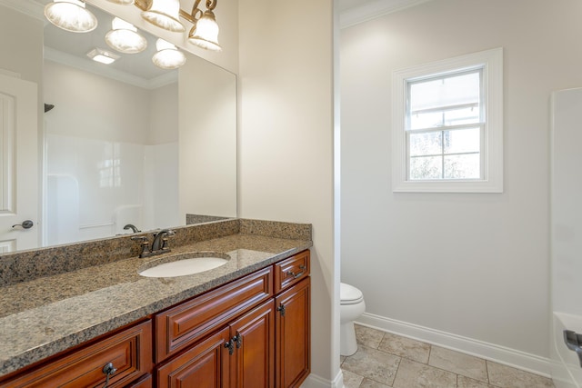 bathroom featuring crown molding, vanity, toilet, and walk in shower