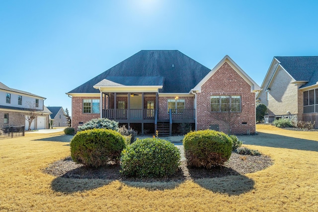 back of property featuring a lawn