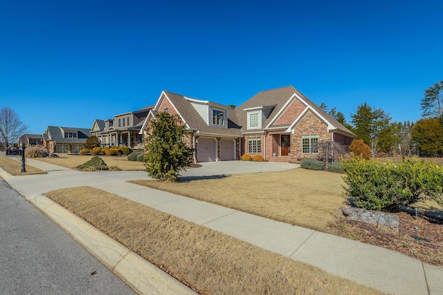 view of front of house featuring a garage and a front lawn