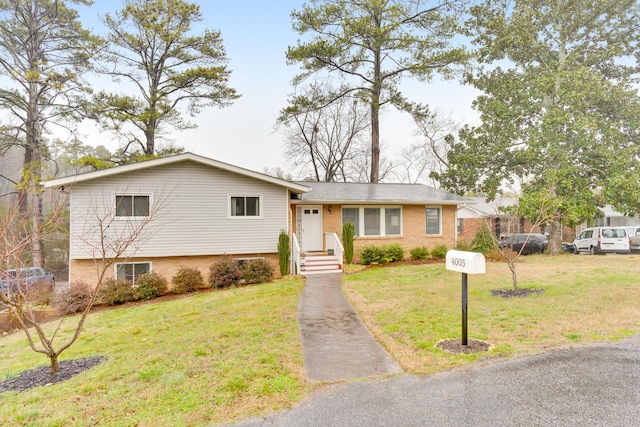 split level home featuring a front yard