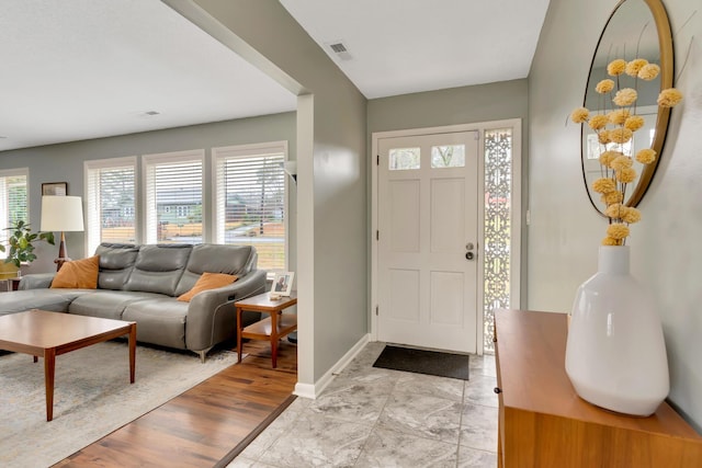 foyer entrance with light wood-type flooring