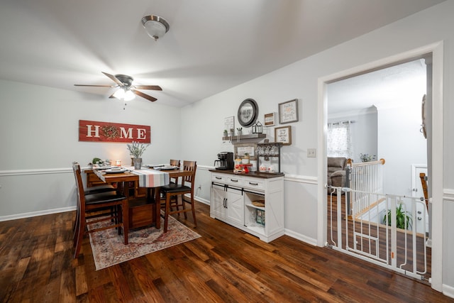 dining area with dark hardwood / wood-style floors