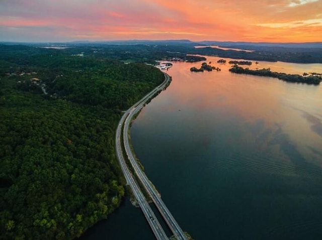 aerial view at dusk with a water view