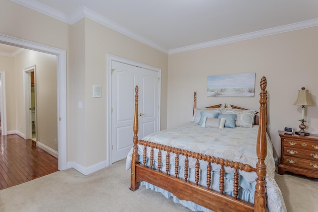 bedroom with crown molding, a closet, and carpet