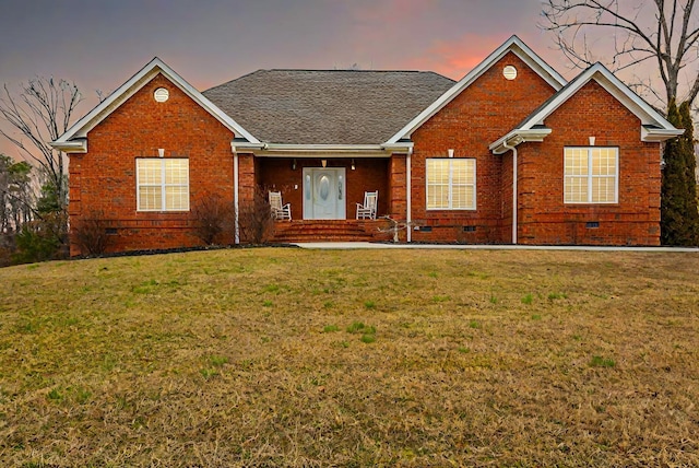 view of front of property with a lawn