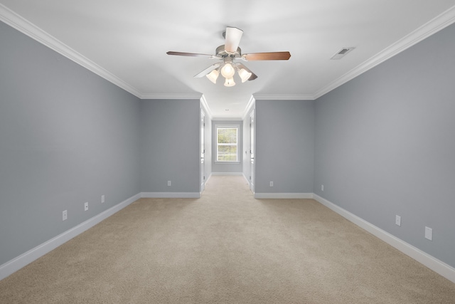 empty room featuring ornamental molding, light carpet, and ceiling fan