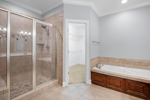 bathroom featuring tile patterned floors, ornamental molding, and independent shower and bath