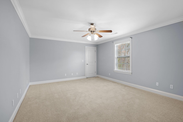 unfurnished room with crown molding, light colored carpet, and ceiling fan