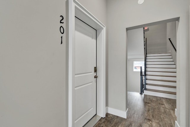 hall with wood-type flooring