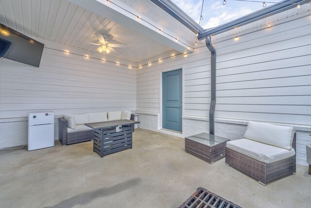 view of patio with outdoor lounge area and ceiling fan