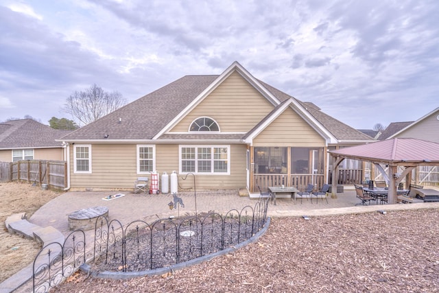 back of house featuring a gazebo, a sunroom, and a patio area