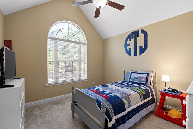 bedroom featuring light carpet, lofted ceiling, and ceiling fan