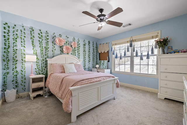 bedroom with light colored carpet and ceiling fan