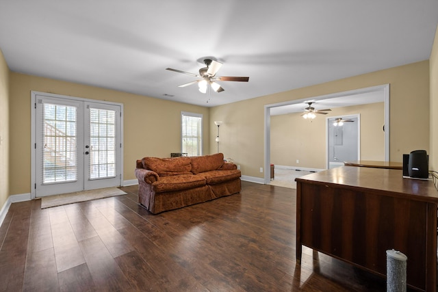 living room featuring dark hardwood / wood-style flooring, french doors, and ceiling fan