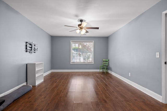 unfurnished room featuring ceiling fan and dark hardwood / wood-style flooring