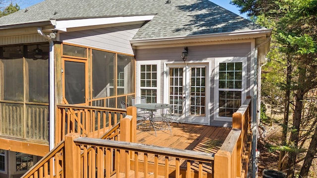 wooden terrace featuring a sunroom