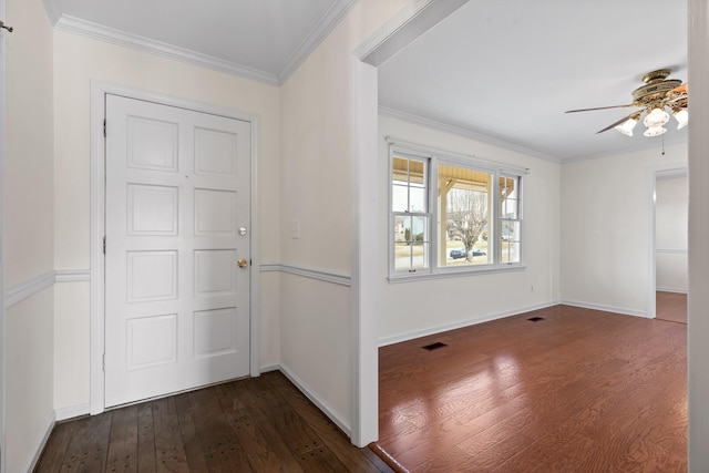 foyer featuring ornamental molding, ceiling fan, and dark hardwood / wood-style flooring