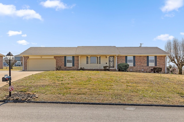 ranch-style house featuring a garage and a front lawn