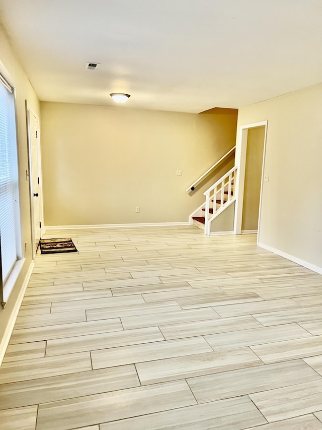 spare room featuring light wood-type flooring