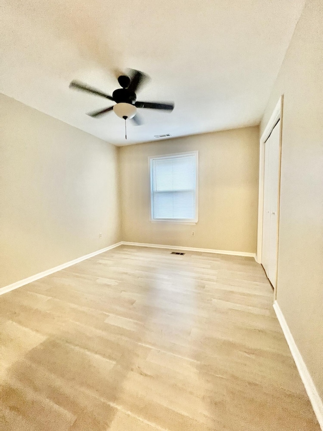 unfurnished room featuring ceiling fan and light hardwood / wood-style floors