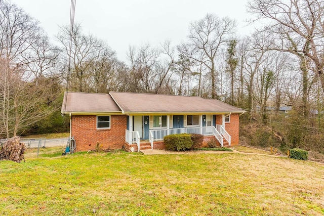 view of front of house with a porch and a front lawn