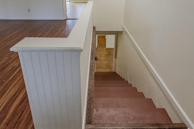 staircase featuring hardwood / wood-style floors